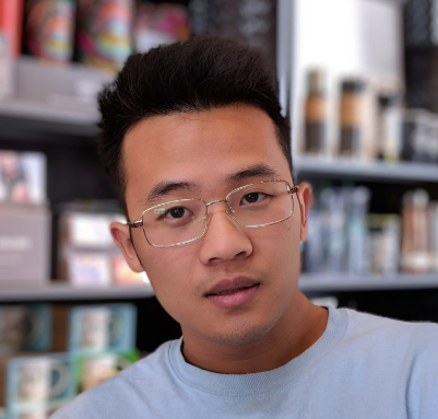 a guy in glasses and a T-shirt